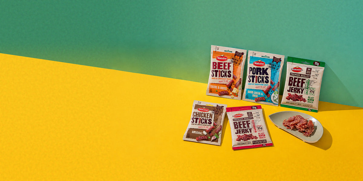 NAKOTNE jerky and meat snack packs on a yellow table