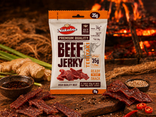 NAKOTNE Beef Jerky Teriyaki pouch with jerky pieces, ginger and teriyaki sauce by a fire